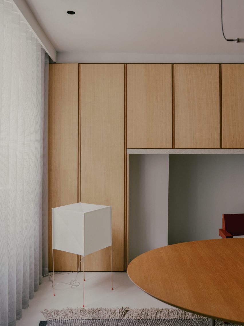 Concrete dining room with timber wall panels