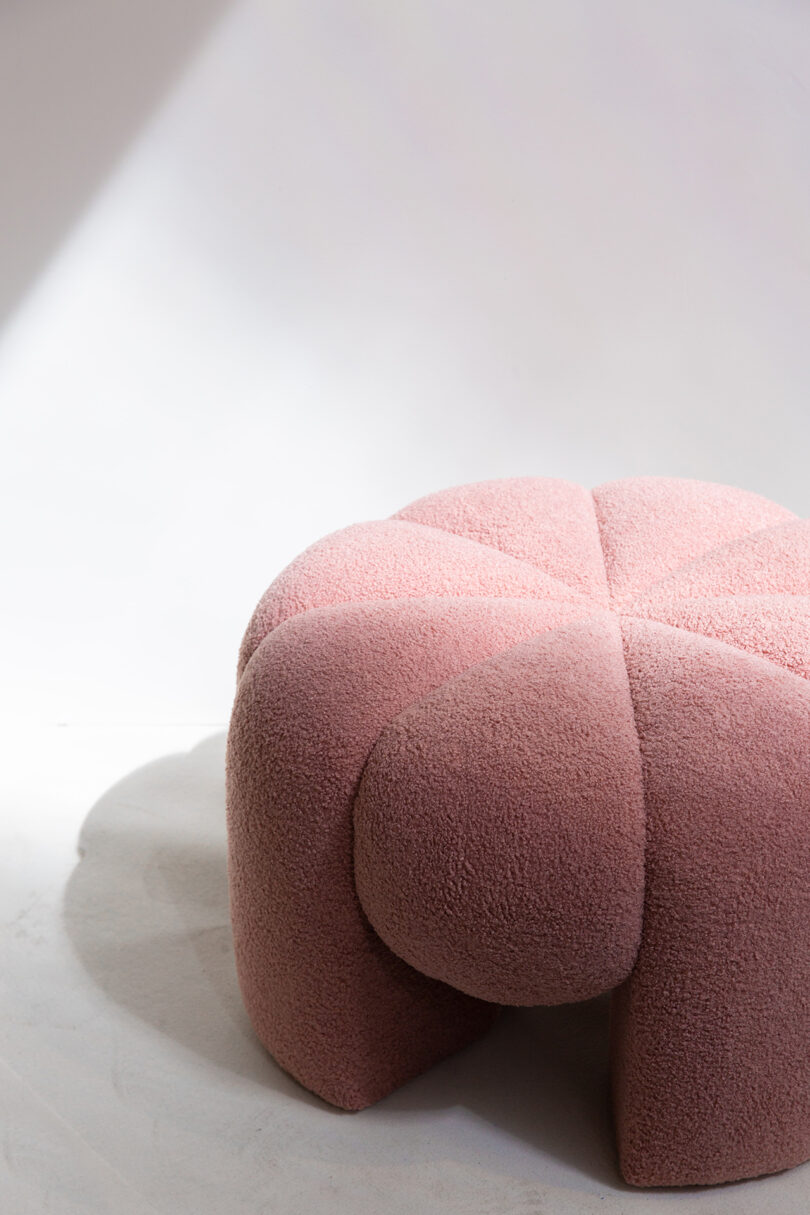 pink ottoman shaped like a flower