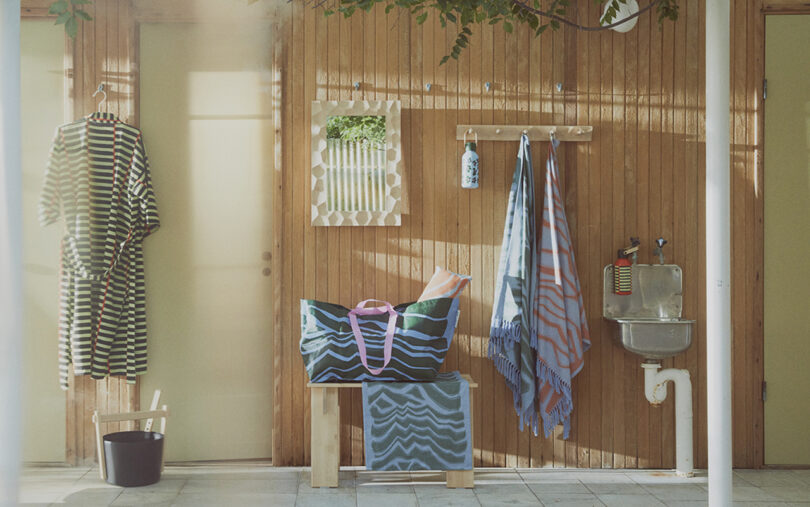 spa-like interior space with robe, bag, stool, and towels