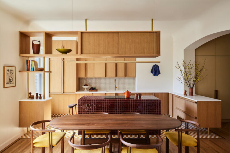 Gently curved plaster cove connecting kitchen, living, and dining areas