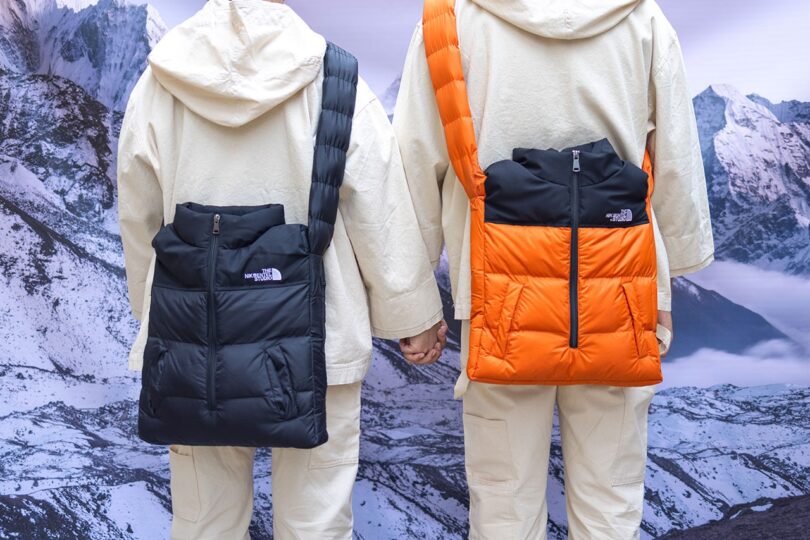 two people wearing bags made from puffer jackets