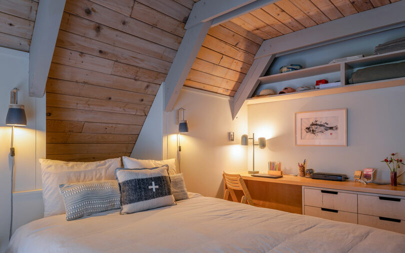 angled view of modern bedroom with wooden ceiling and walls