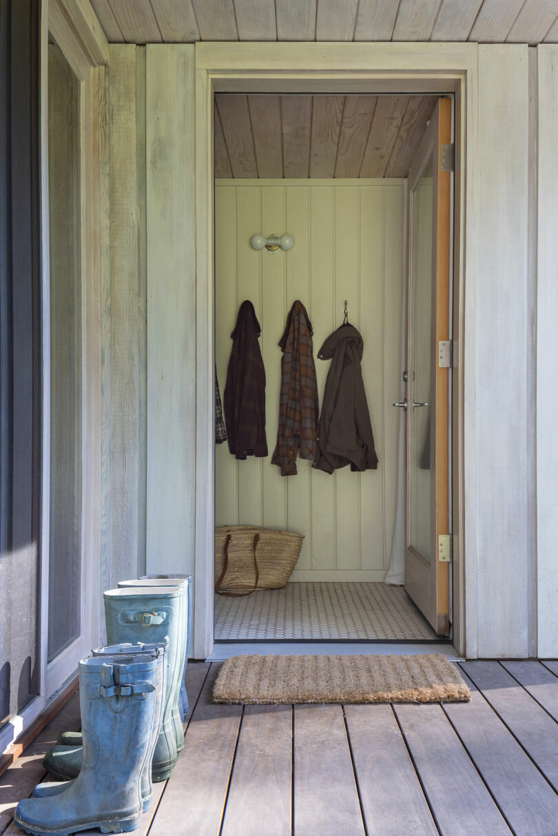 exterior view of entrance into modern cabin with door open
