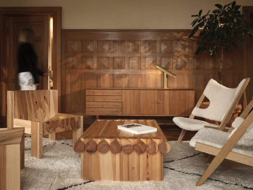 wooden coffee table surrounded by four wooden chairs