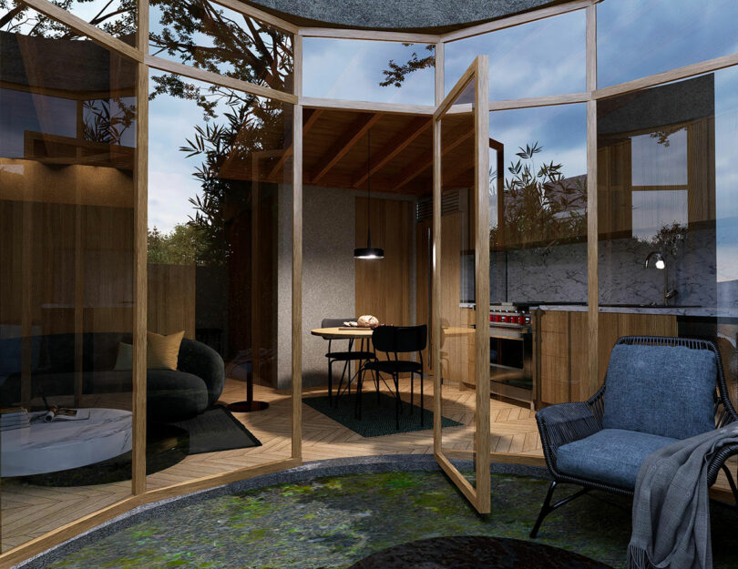 exterior front view of small accessory dwelling unit with curved wall of windows and door open