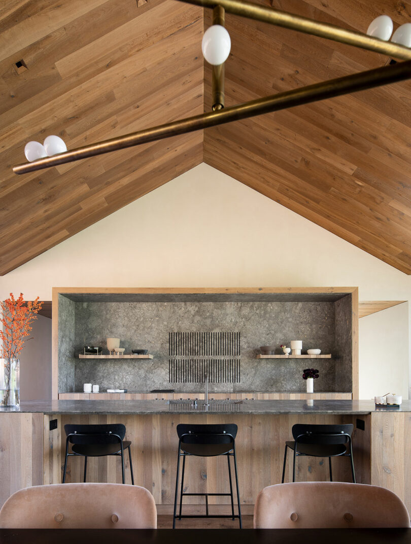 view of modern kitchen under pitched wood ceiling