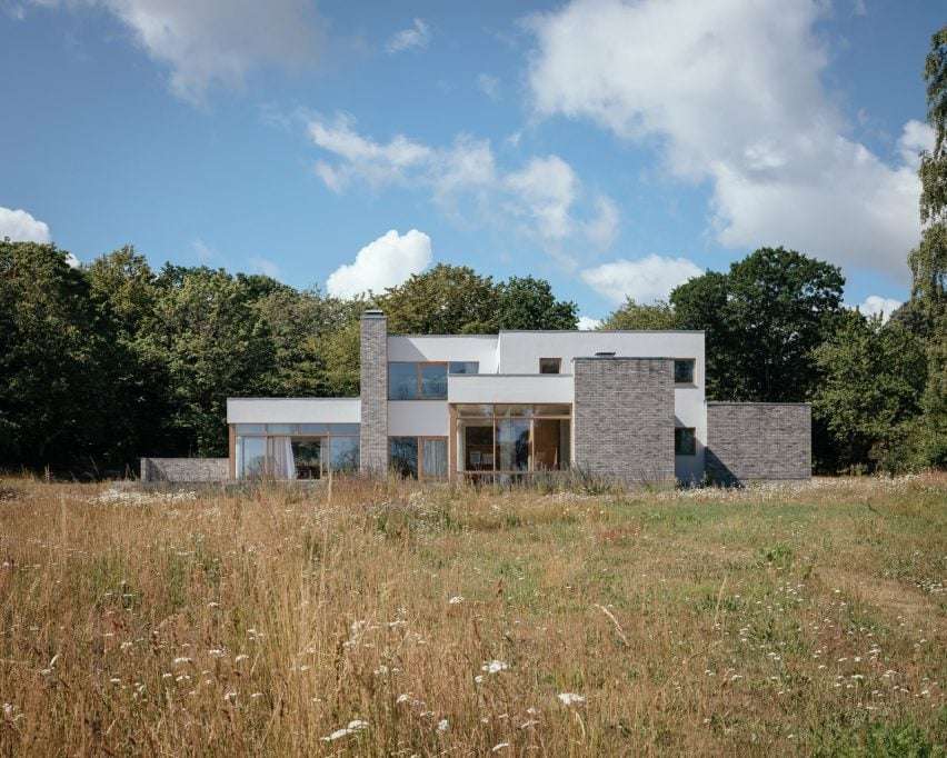 Front view of blocky white home in Sweden by Asa Hjort Architects