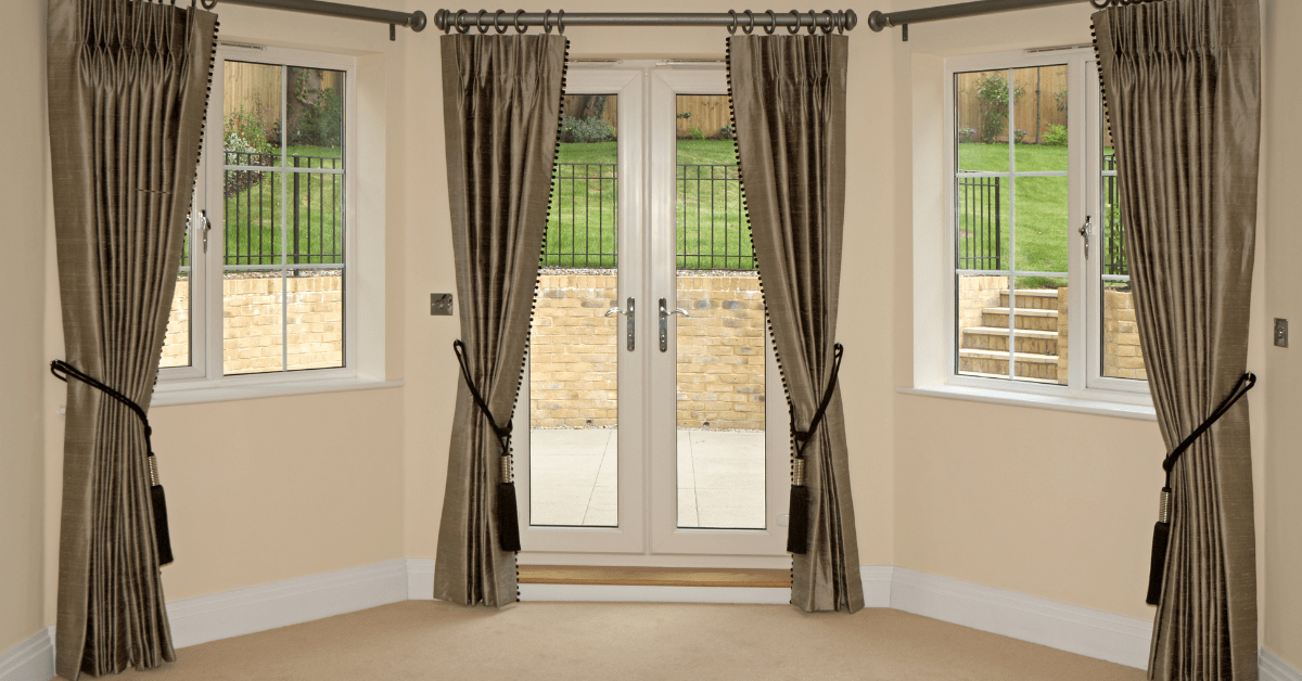 Silky dark bay window curtains.