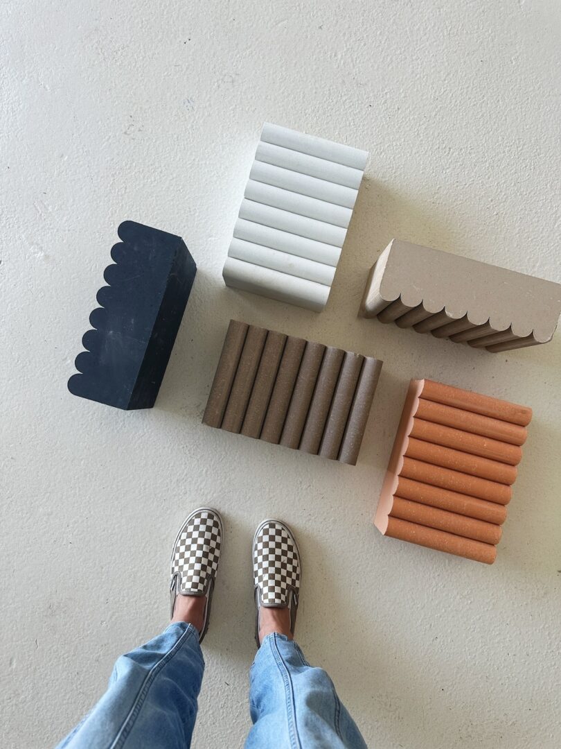 feet next to five fluted bricks