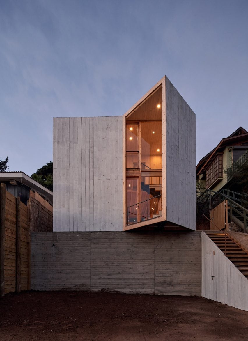 A cement house with angled opening