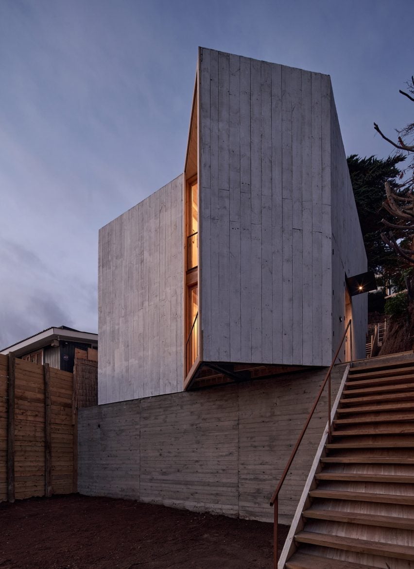 A cement house with angled opening