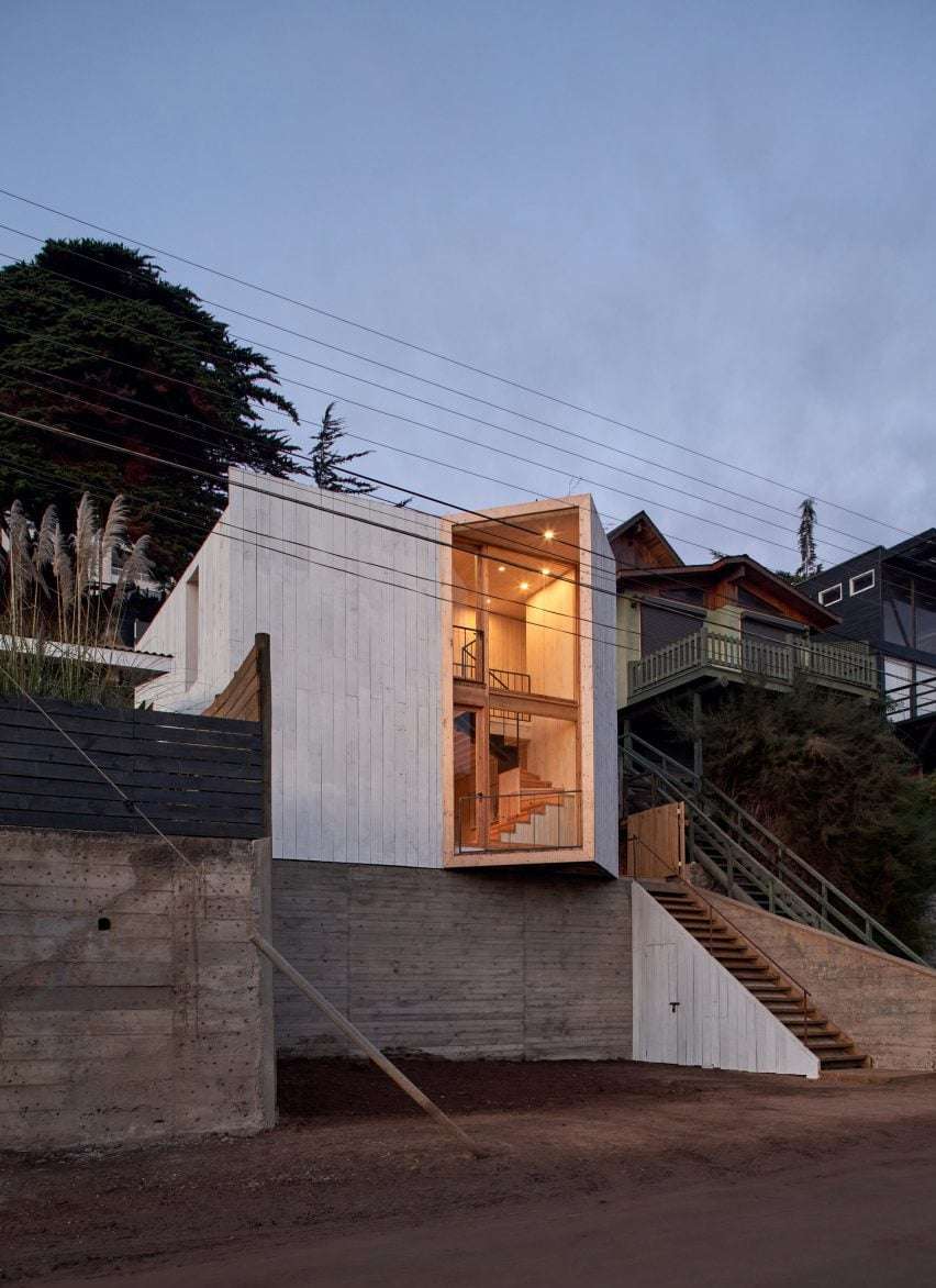 Cement home on hill with angled entrance