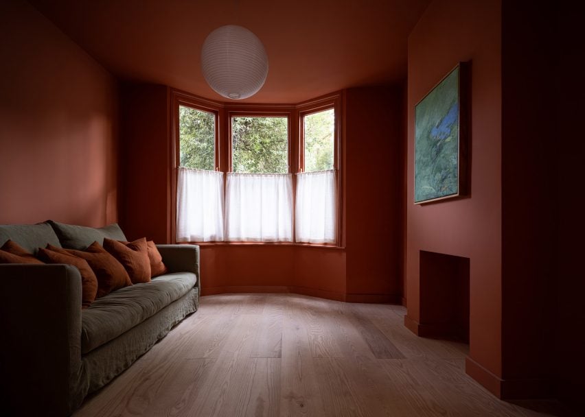 Red-hued lounge in London home