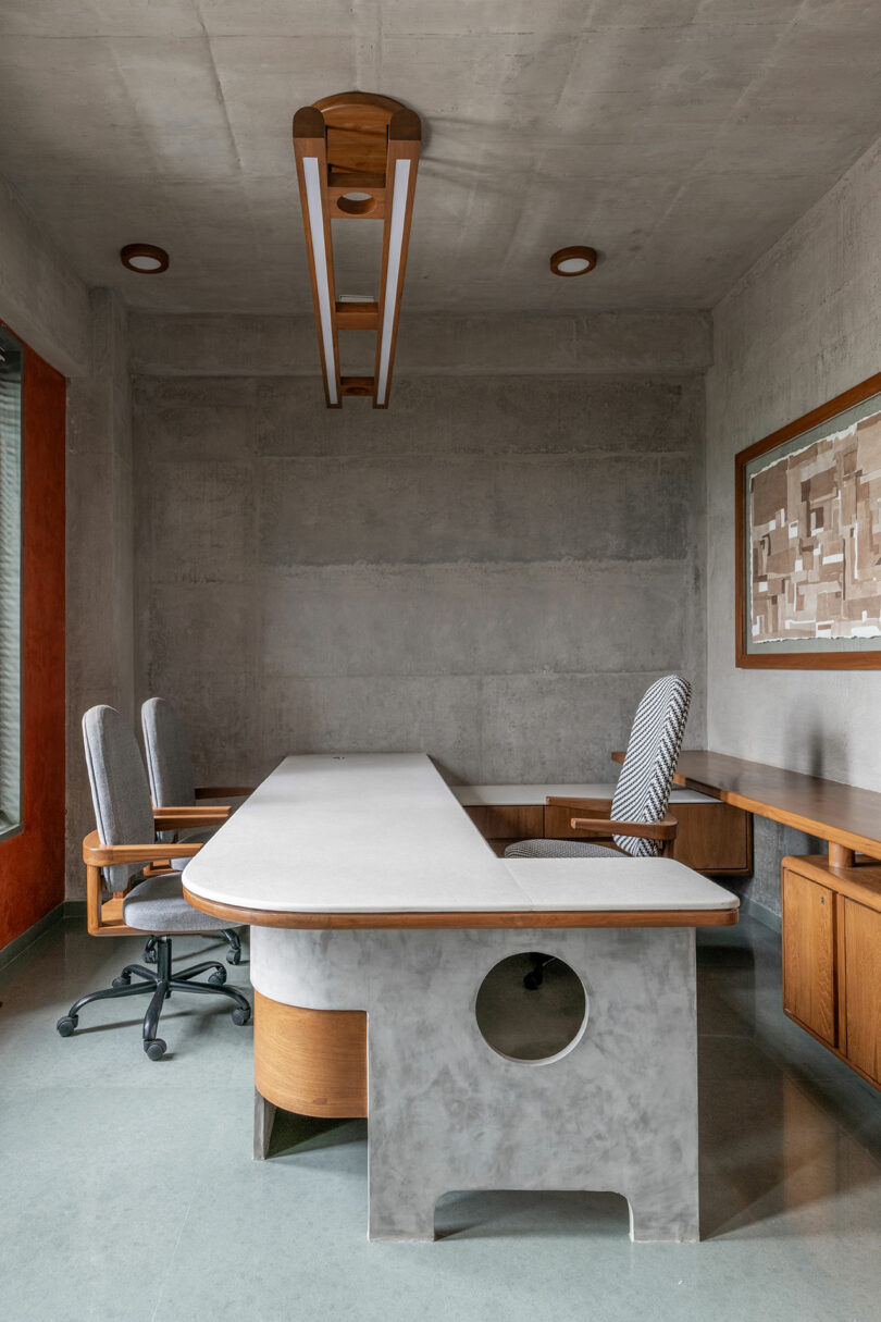 Office space with long desk and chairs