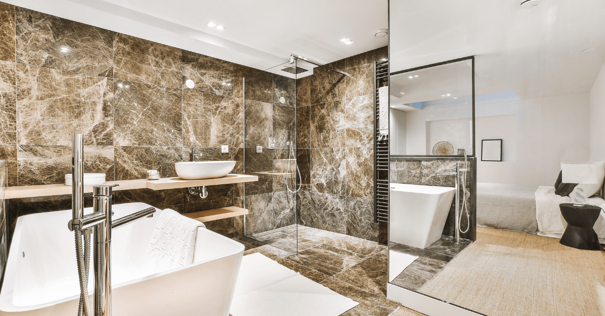 Dark marble wet room bathroom with white vanities.