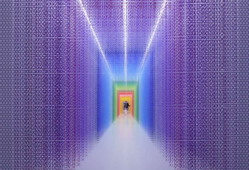 woman walking through a colorful installation of acrylic transparent sheets