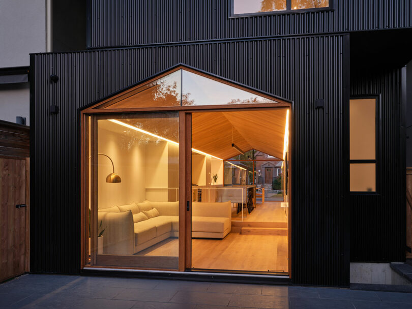 closeup angled view of modern home's first floor sliding glass door entrance looking into living room