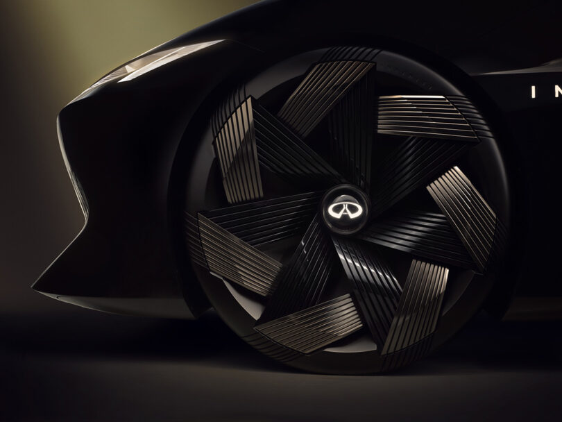 Close up of the all-electric INFINITI Vision Qe fastback sedan's intricate spoked wheels.