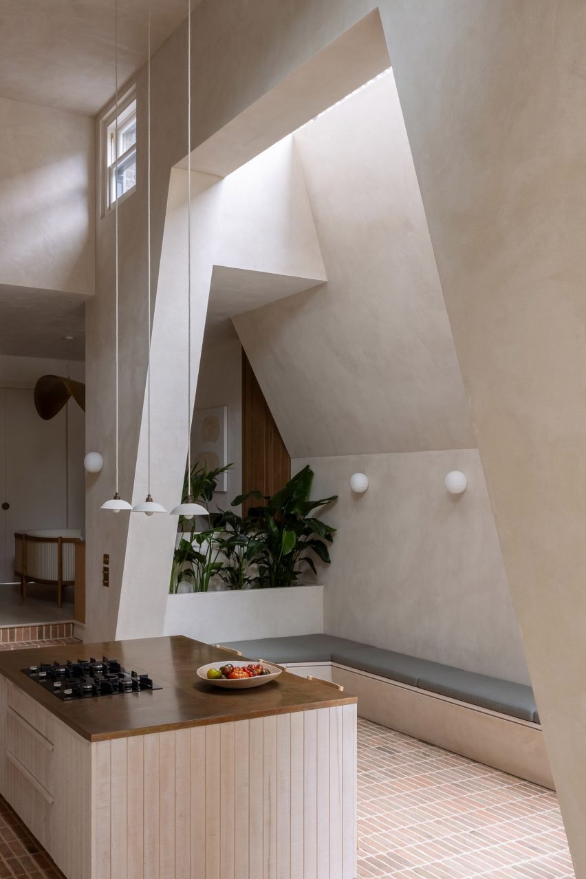 Kitchen with brick floor and clay-plaster walls