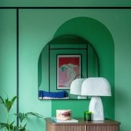 Green wall and arched mirror in Moroccan-inspired townhouse by PL Studio