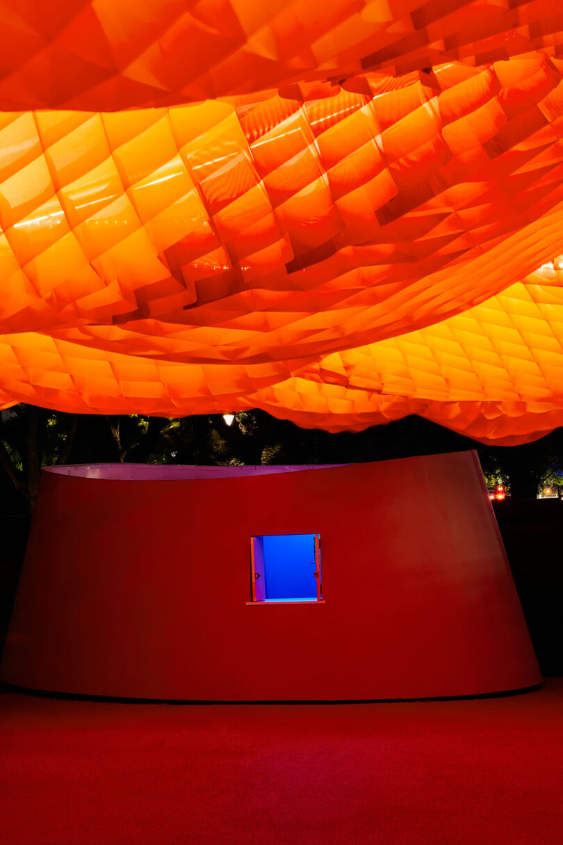 interior of orange net-like outdoor pavilion