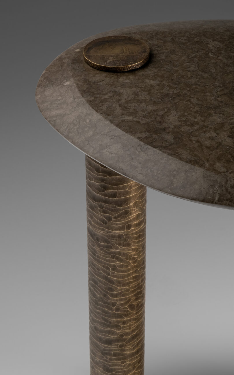 detail of metal and marble table