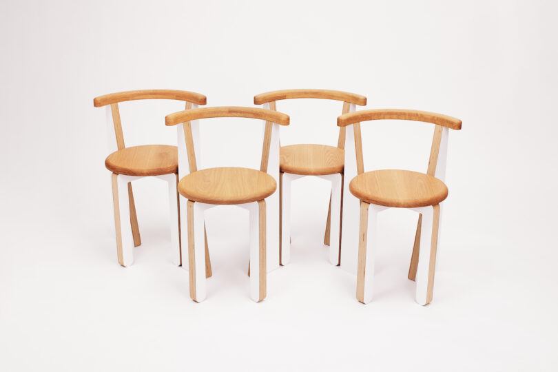 four white dining chairs