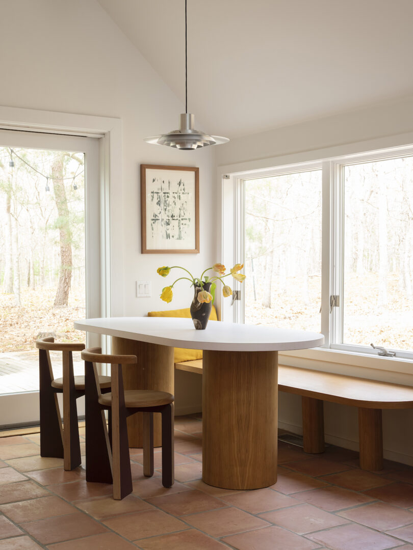 oval dining table with brown dining chairs in kitchen nook