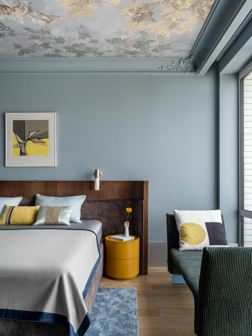 partial modern bedroom view with half of bed featured with curved wood headboard