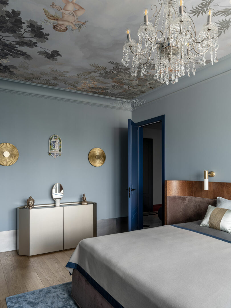 partial modern bedroom view with half of bed featured with curved wood headboard