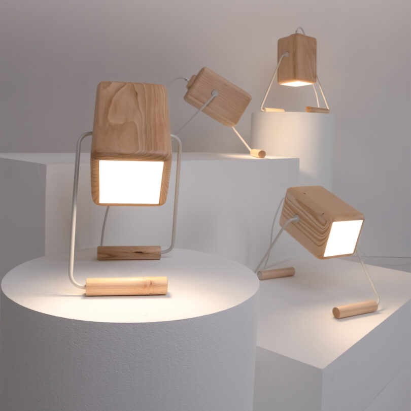four cube-shaped table lamps