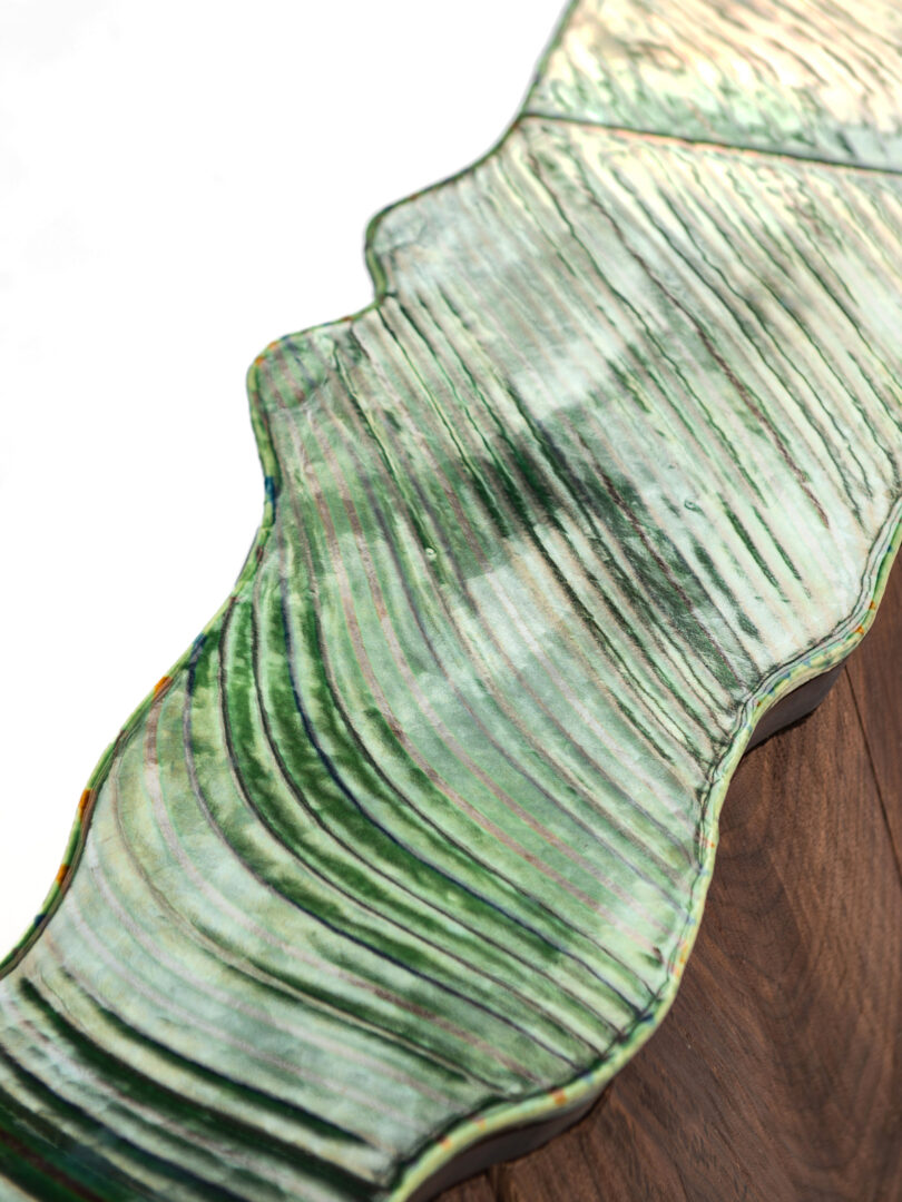 green ceramic and wood island table