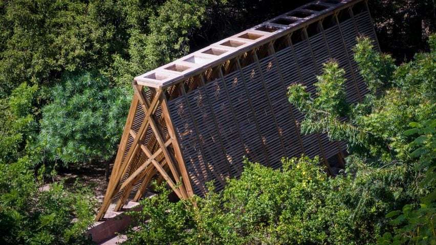 View of A frame pavilion from above in treeline