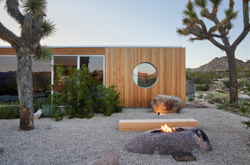 partial exterior view of modern wood pavilion style house in desert