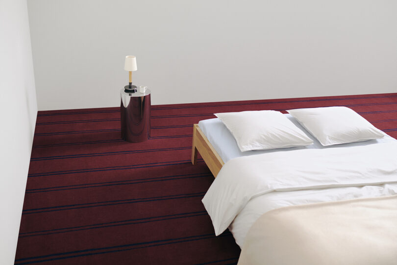 tone on ton red rug with bed and night table