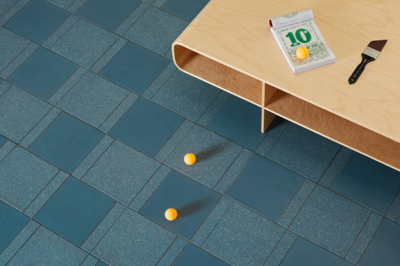 ping pong balls and coffee table on blue tiles