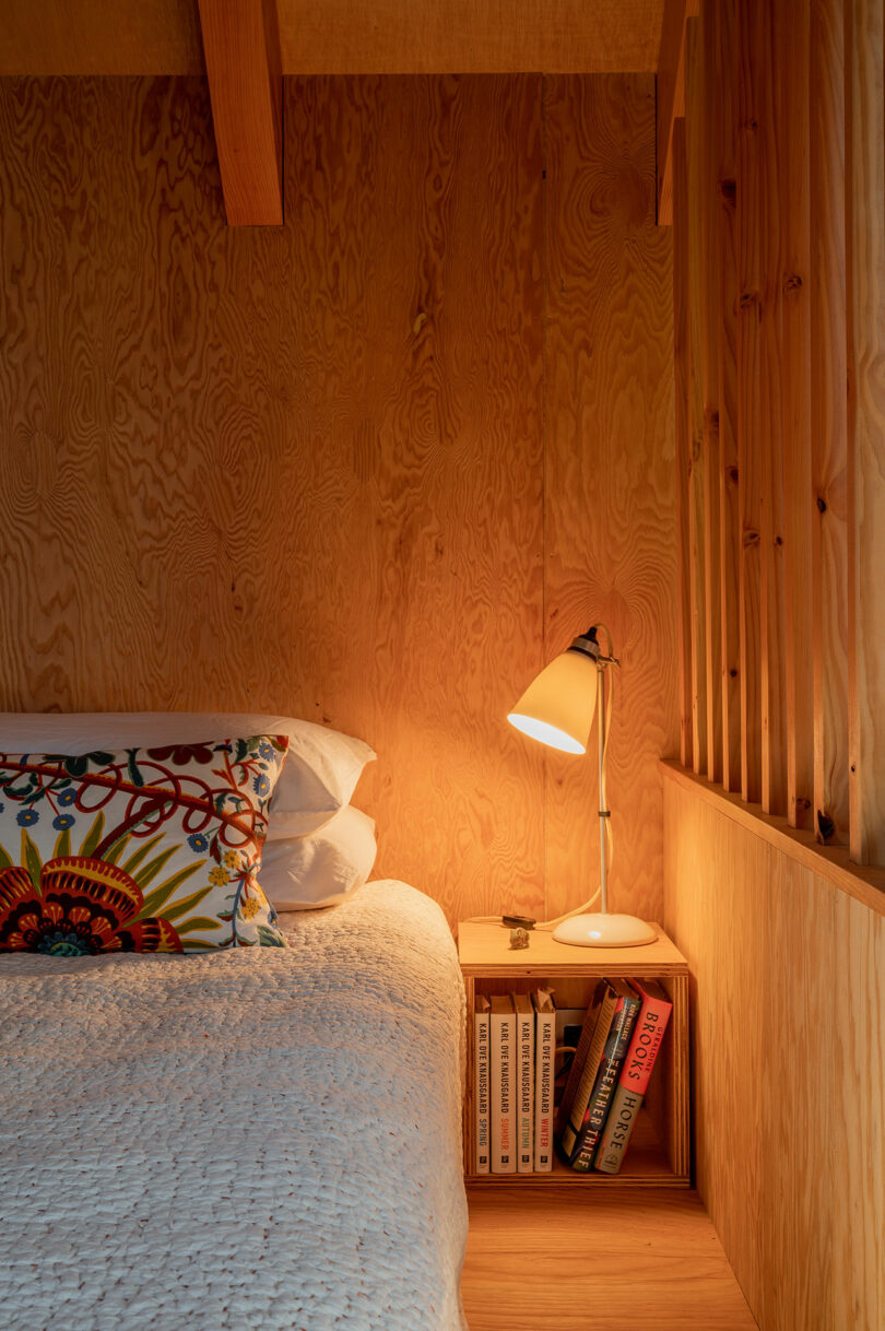 partial view of simple bedroom in modern cabin