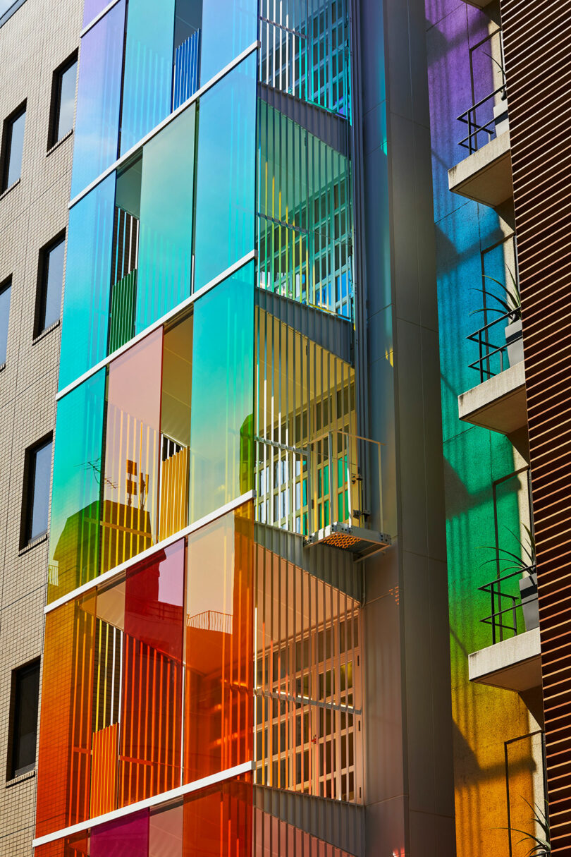 closeup side exterior view of rainbow fronted office building