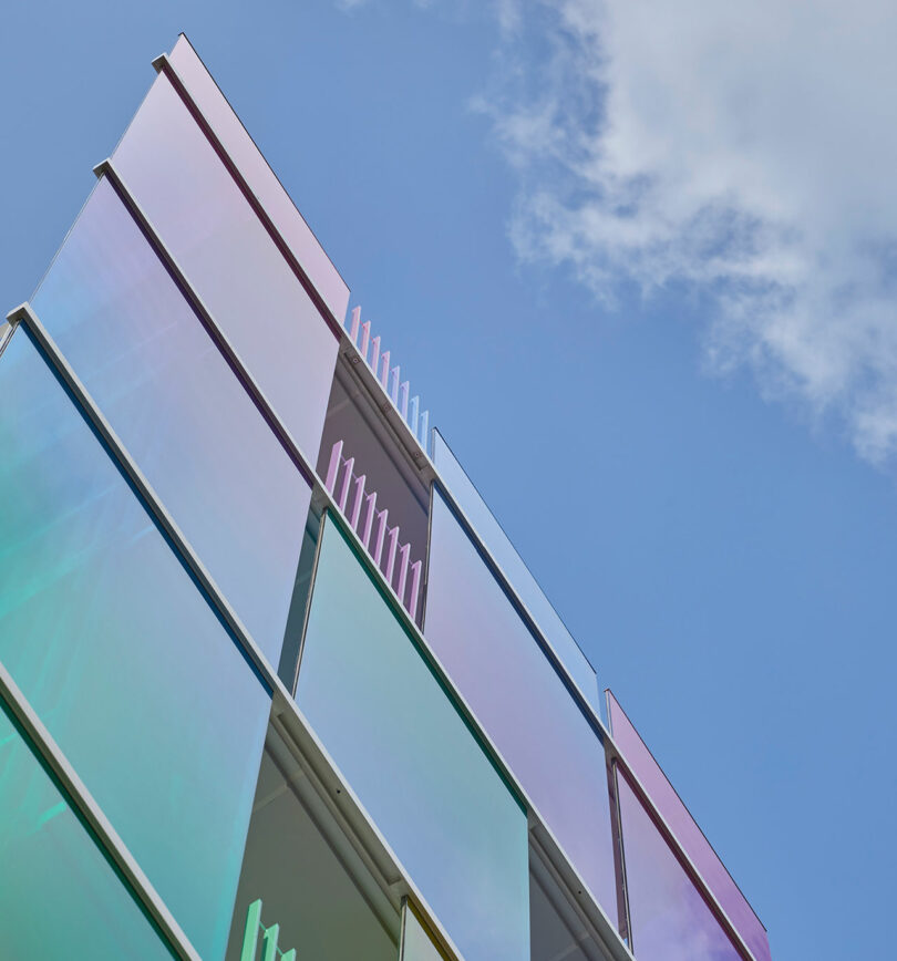 top corner exterior view of rainbow fronted office building
