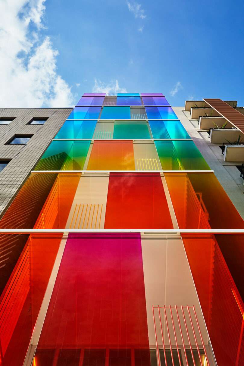 upward exterior view of rainbow fronted office building