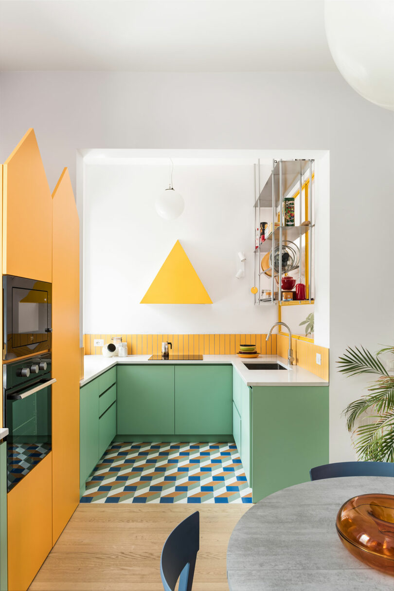 A brightly colored kitchen with a tiled floor.