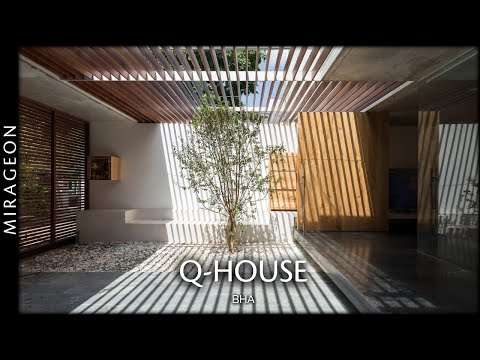 Combining Raw Concrete with Wood Around a Central Void | Q-House