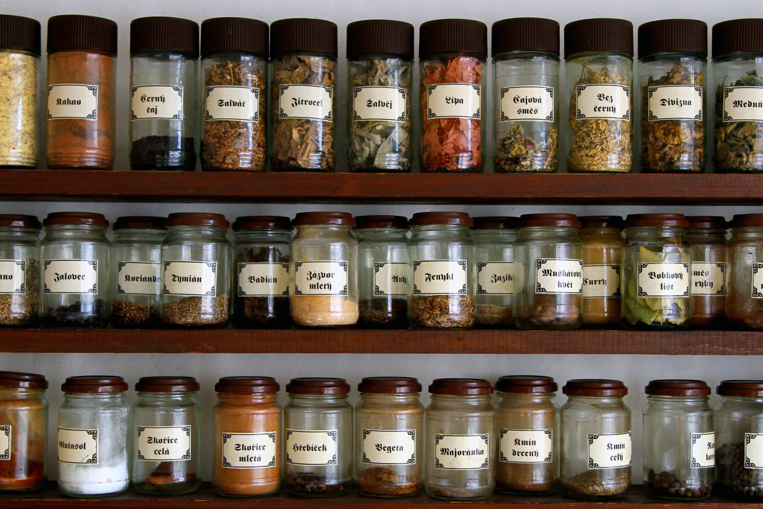 Floating shelves serving as a spice rack.