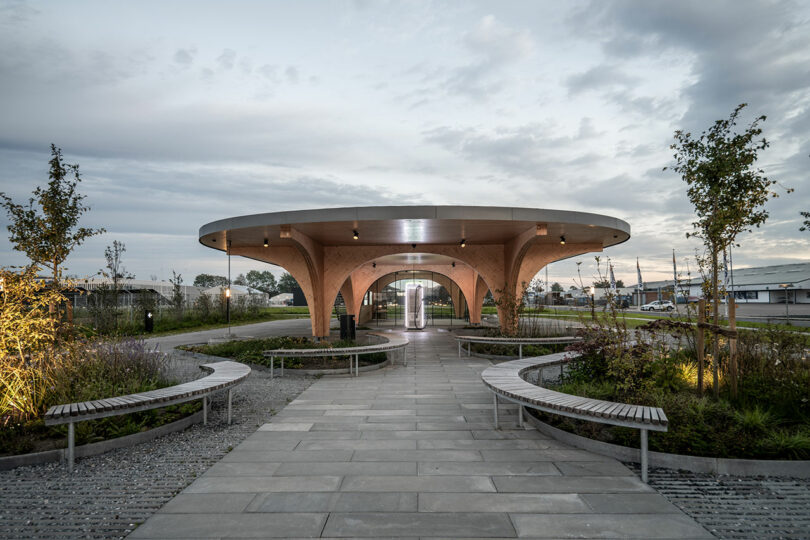 A circular walkway with benches and trees for relaxation.