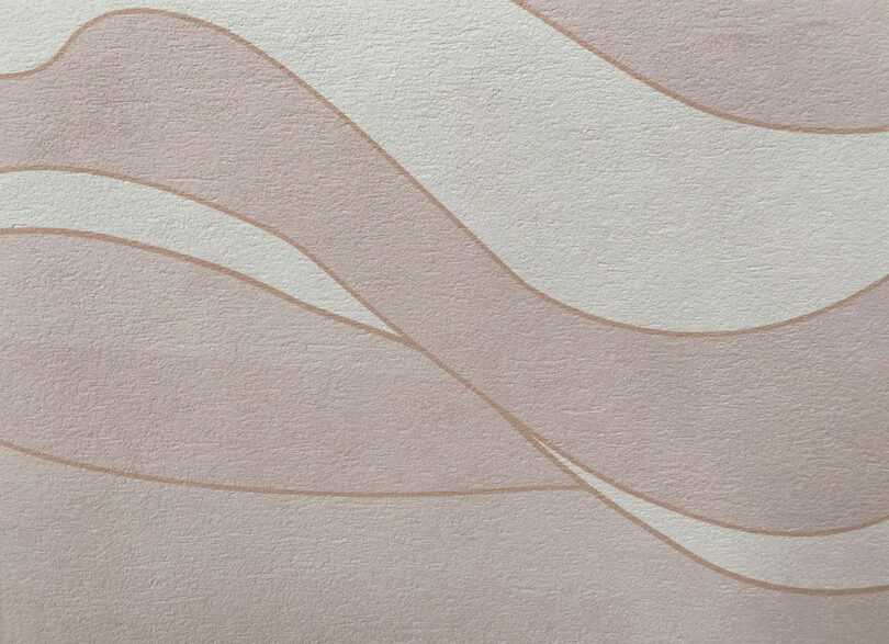 Abstract wavy lines in shades of pink on a textured surface.