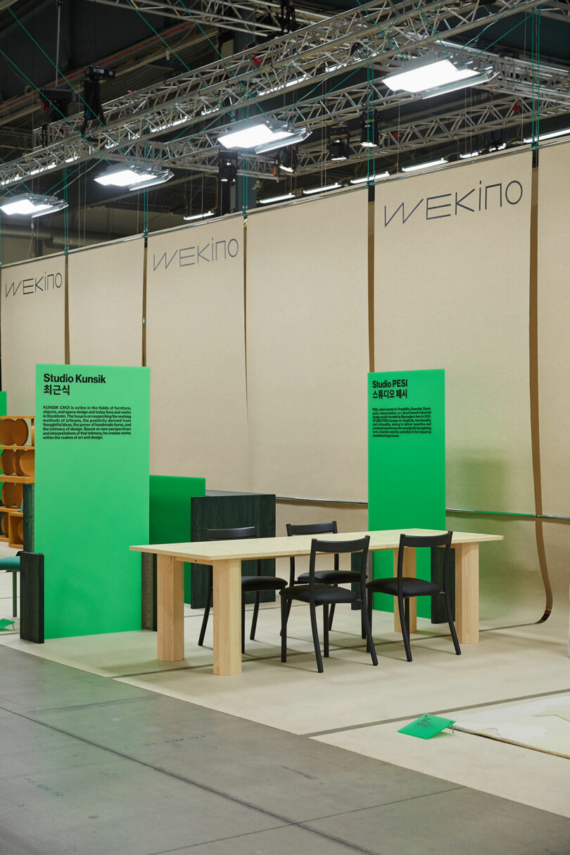 A table and chairs on display at an exhibition.