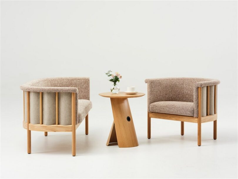 wooden coffee table next to two beige and wood lounge seats