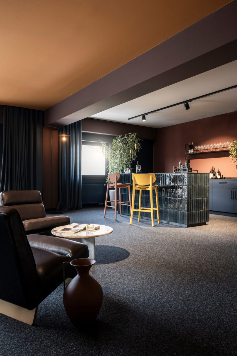 Modern home bar corner with NOA elegant furniture and warm lighting.