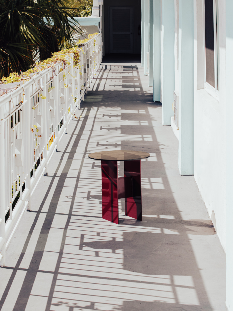 red metal table on balcony outside