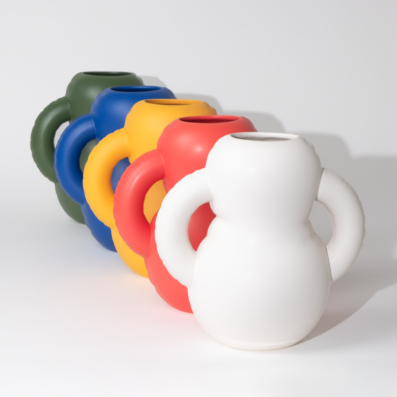 A lineup of colorful, ceramic vases